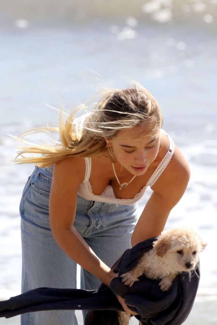 Alexis Ren Spotted At The Beach With Her Puppy In Malibu