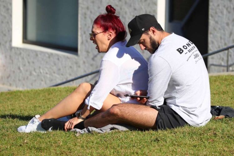 Sharna Burgess Relaxing In A While Shirt Out In Bondi