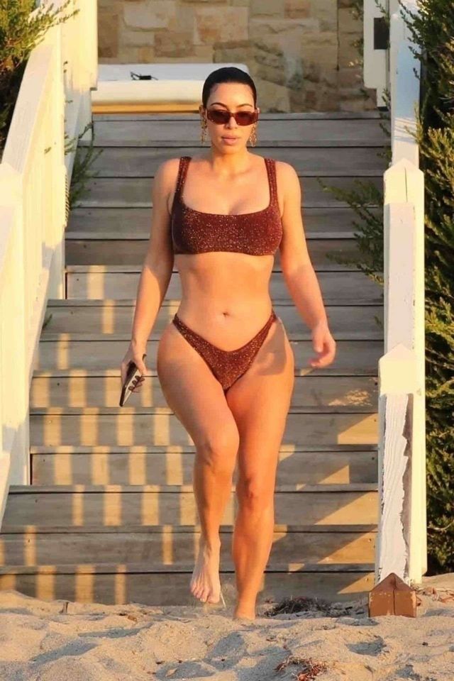 Kim Kardashian In A Maroon Quaran-Kini At The Early Sunrise Beach Stroll In Malibu