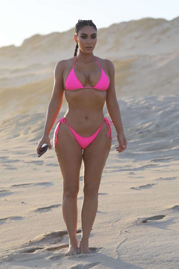 Kim Kardashian Wet In A Pink Bikini For A KKW Beauty Photoshoot