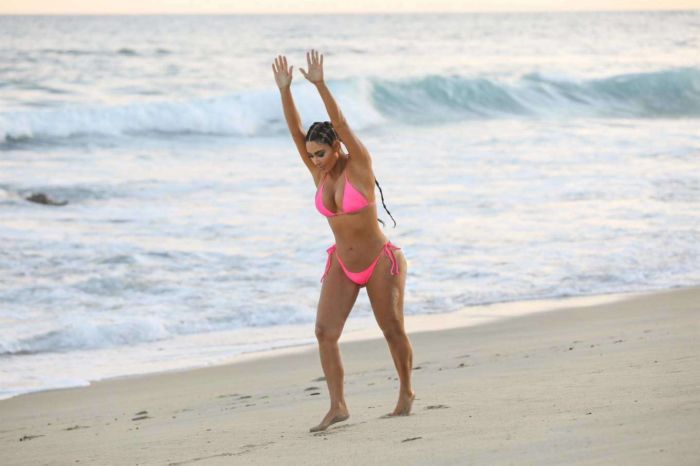 Kim Kardashian Wet In A Pink Bikini For A KKW Beauty Photoshoot