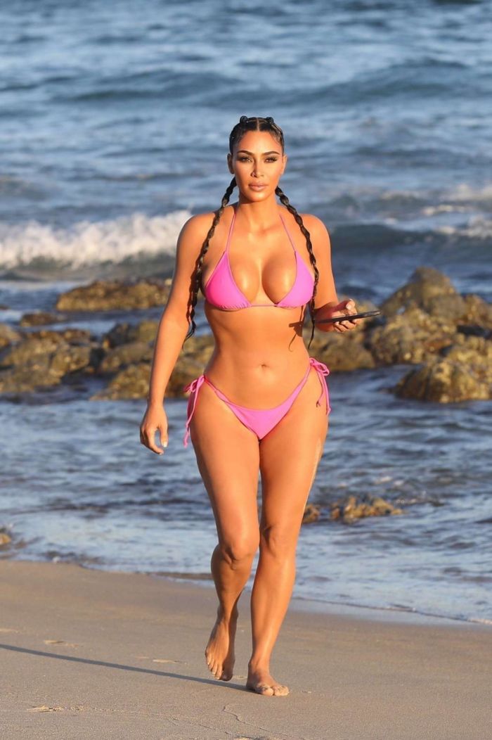Kim Kardashian Wet In A Pink Bikini For A KKW Beauty Photoshoot