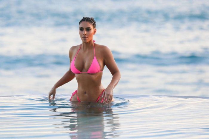 Kim Kardashian Wet In A Pink Bikini For A KKW Beauty Photoshoot