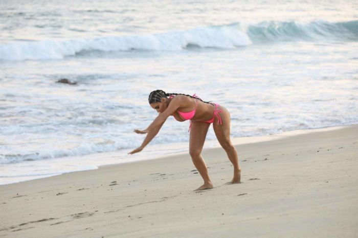 Kim Kardashian Wet In A Pink Bikini For A KKW Beauty Photoshoot