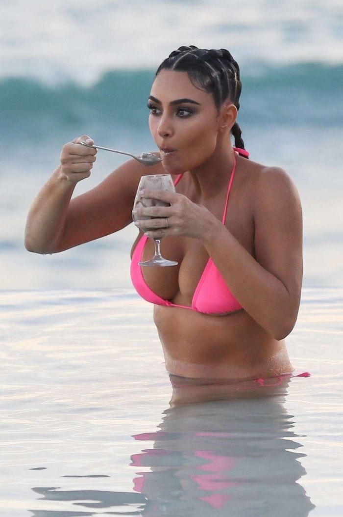 Kim Kardashian Wet In A Pink Bikini For A KKW Beauty Photoshoot