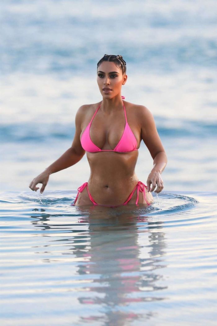 Kim Kardashian Wet In A Pink Bikini For A KKW Beauty Photoshoot