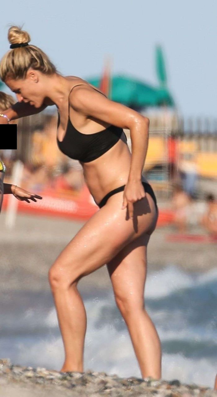 Michelle Hunziker Vacationing In Bikini On The Beach With Her Family