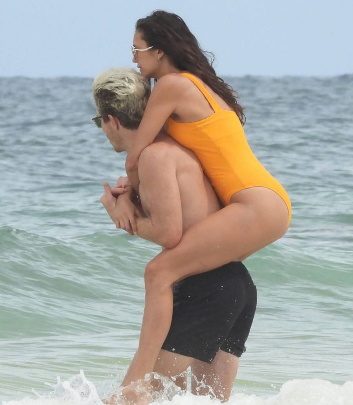 Nina Dobrev In An Orange Swimsuit With Shaun White At Tulum Beach