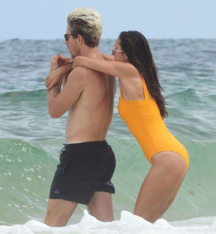 Nina Dobrev In An Orange Swimsuit With Shaun White At Tulum Beach