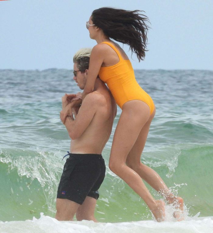 Nina Dobrev In An Orange Swimsuit With Shaun White At Tulum Beach