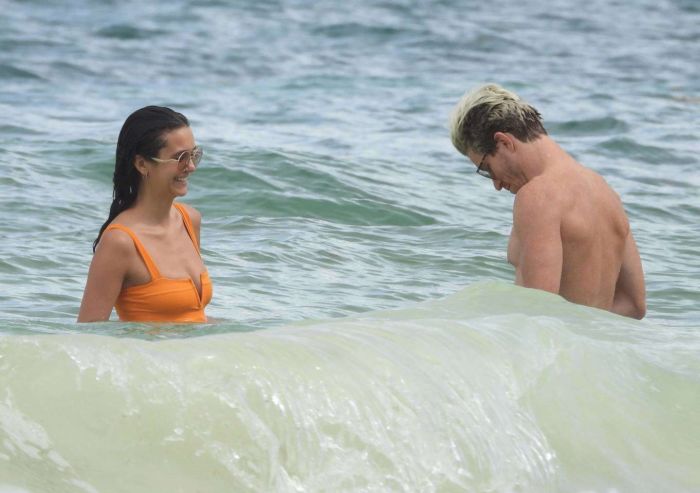 Nina Dobrev In An Orange Swimsuit With Shaun White At Tulum Beach